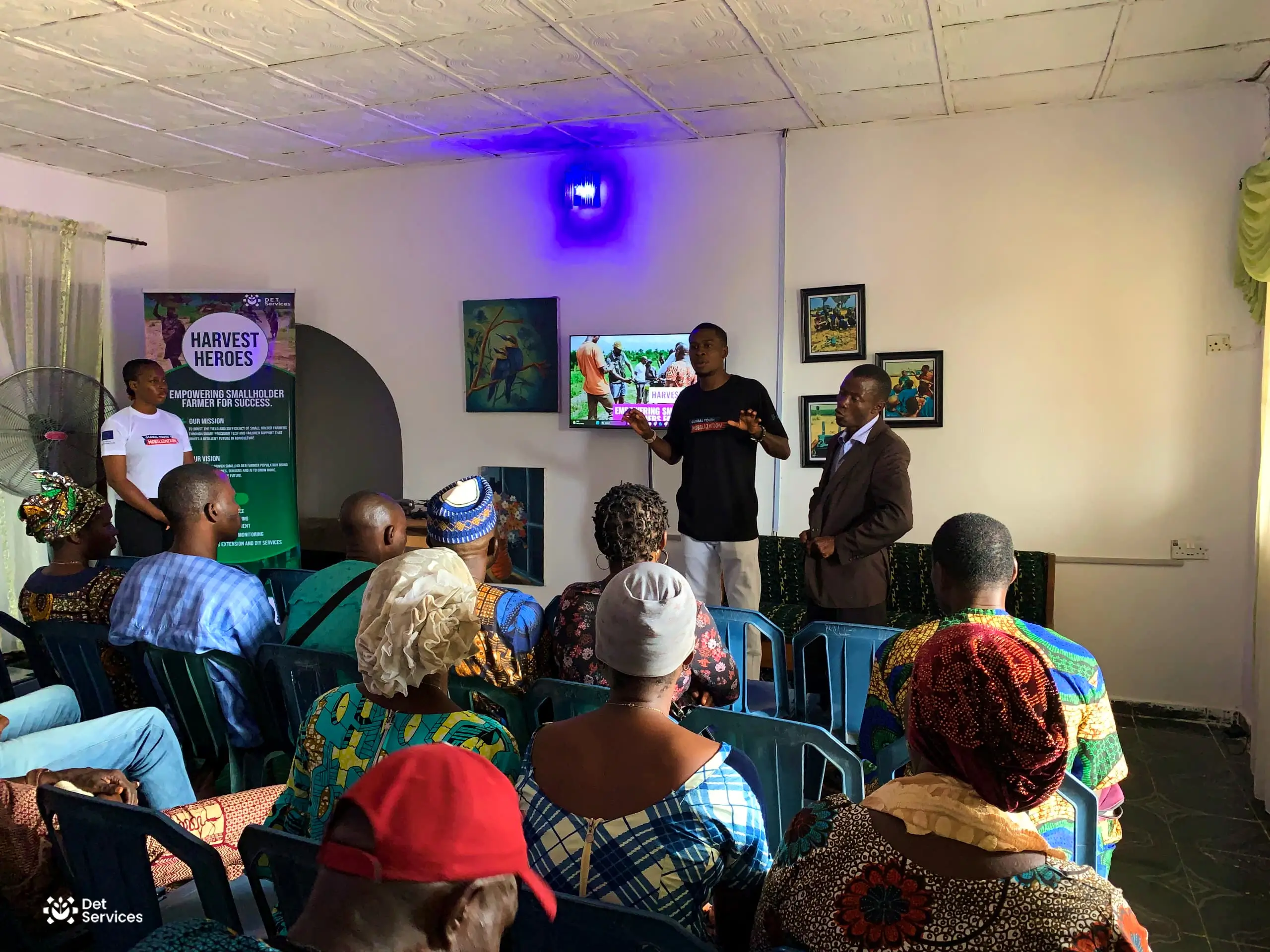 Ted Eni engaging with community members through D.E.T Services' agricultural initiatives