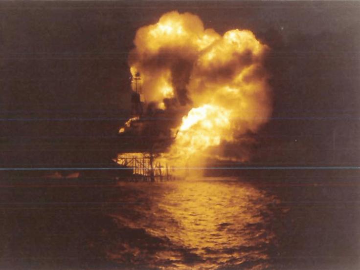Large fire and smoke at Piper Alpha at night as the disaster escalated