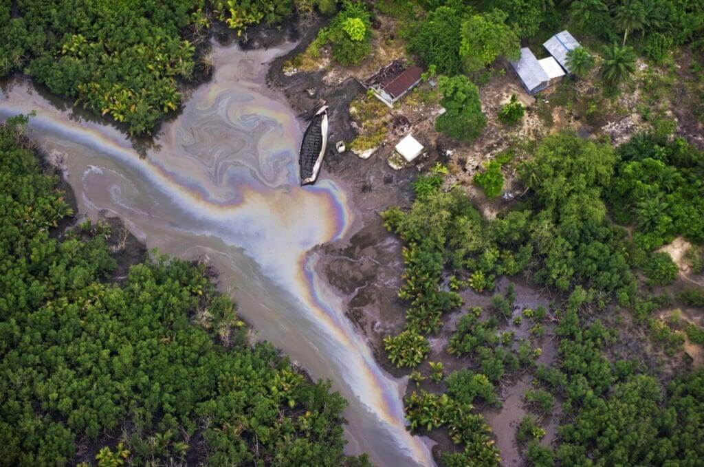 Aerial view of an oil-affected creek and surrounding vegetation in Ogoniland